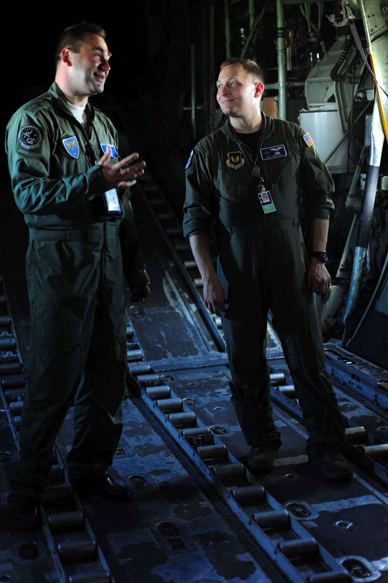 Romanian Air Force flight engineer Nicu Romica provides a tour of a C-130B to U.S. Air Force Tech. Sgt. David Dais loadmaster from the 37th Airlift Squadron.  Members of the U.S. and Romanian Air Forces joined together for a week long exercise to build partnerships and enhance proficiency in working together. (U.S. Air Force Photo by Staff Sgt. Jocelyn Rich)