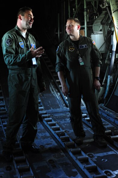 Romanian Air Force flight engineer Nicu Romica provides a tour of a C-130B to U.S. Air Force Tech. Sgt. David Dais loadmaster from the 37th Airlift Squadron.  Members of the U.S. and Romanian Air Forces joined together for a week long exercise to build partnerships and enhance proficiency in working together. (U.S. Air Force Photo by Staff Sgt. Jocelyn Rich)