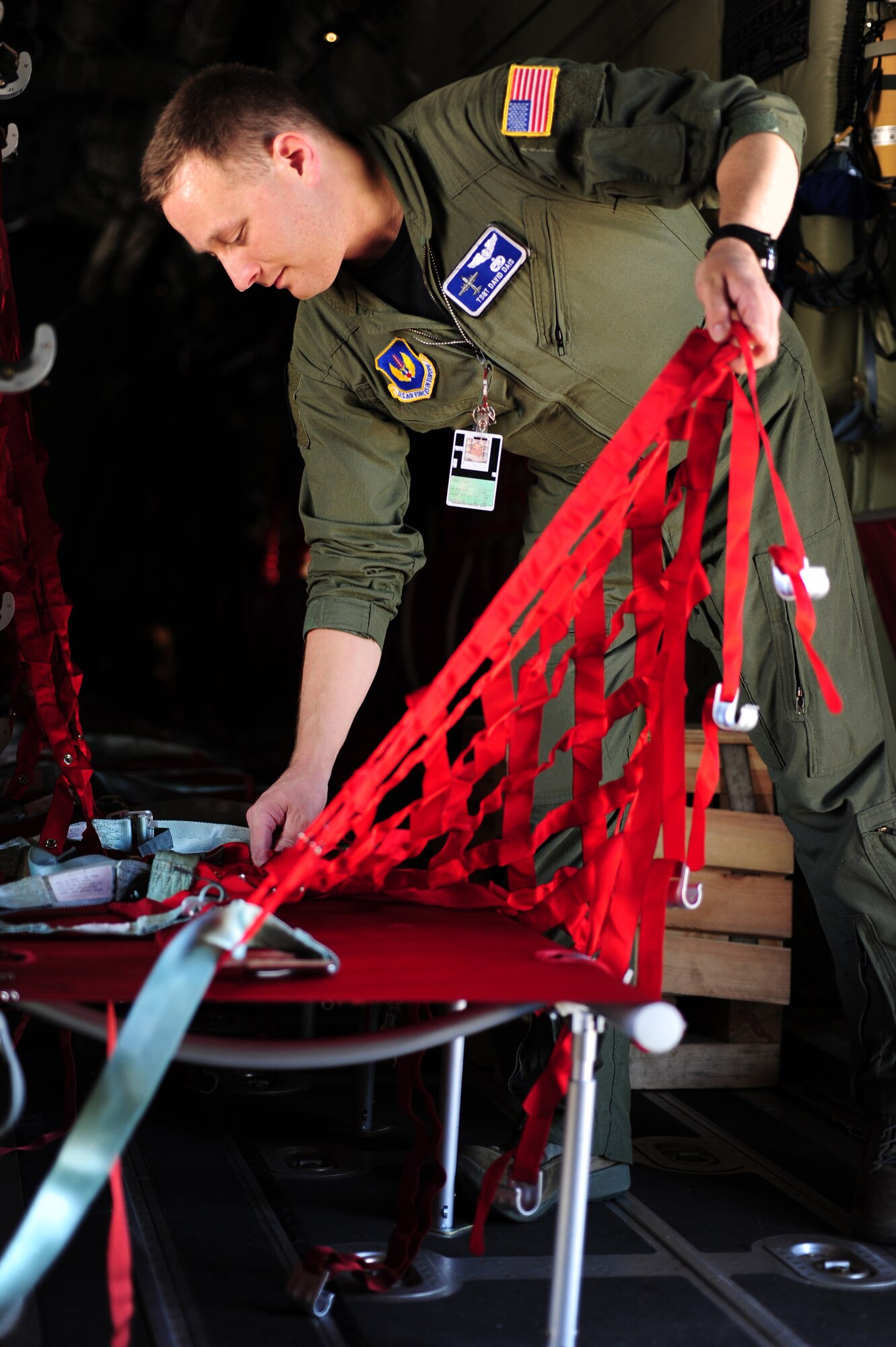 U.S. Air Force Tech. Sgt. David Dais, 37th Airlift Squadron loadmaster, assembles additional jump seats in a C-130J in preparation of welcoming Romanian Air Force members for a jump during the joint exercise Carpathian Summer, Otopeni Airlift Base, Romania, May 10, 2010. Members of the U.S. and Romanian Air Forces joined together for a week long exercise to build partnerships and enhance proficiency in working together. (U.S. Air Force Photo by Staff Sgt. Jocelyn Rich)