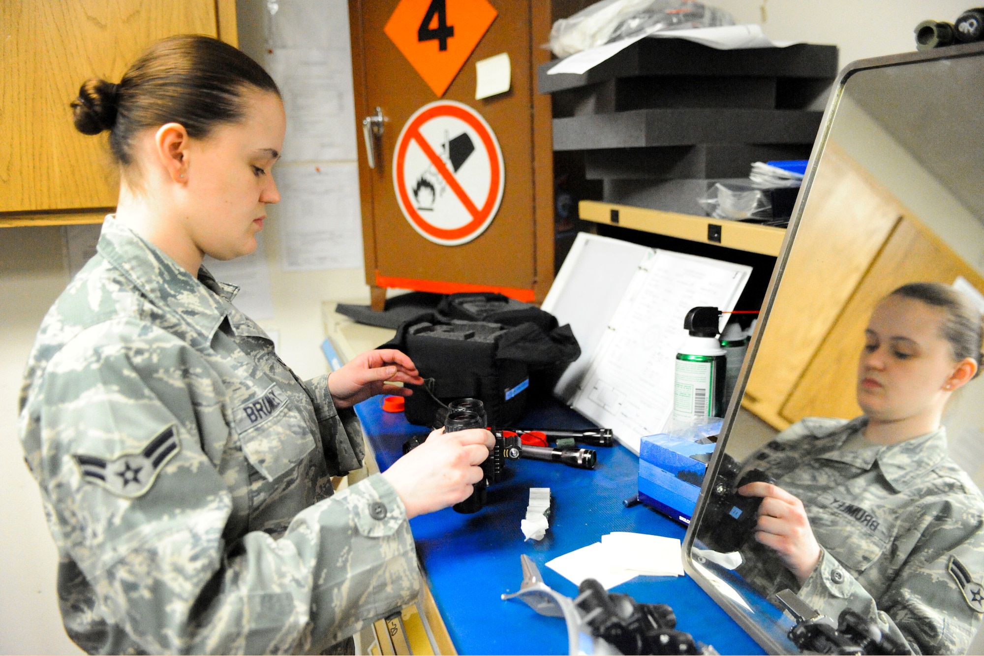 ELMENDORF AIR FORCE BASE, Alaska—Airman 1st Class Jill Brumley, 19th Fighter Squadron Aircrew Flight Equipment specialist, packs a pair of Night Vision Goggles after inspecting them May 6. Airman Brumley, along with the other 19th FS members, will be reassigned to a new squadron after the 19th FS is deactivated in September. (Air Force photo by Airman 1st Class Jack Sanders)