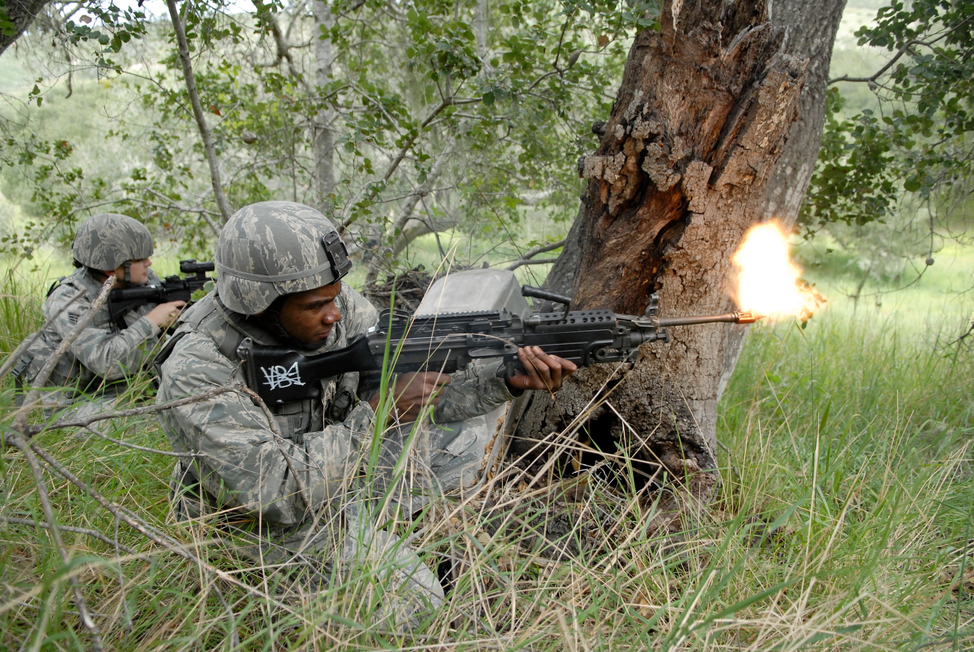 VANDENBERG AIR FORCE BASE, Calif. -- Firing at the opposition, Airman 1st Class Harold Moore, a 30th Security Forces Squadron member, covers his fellow Airmen during a close-quarter battle training exercise here Tuesday, Feb. 23, 2010.  Throughout the training the Airmen learned to work as a team and  communicate with their fellow teammates.  (U.S. Air Force photo/Senior Airman Andrew Satran) 


 

 
 


 


 

