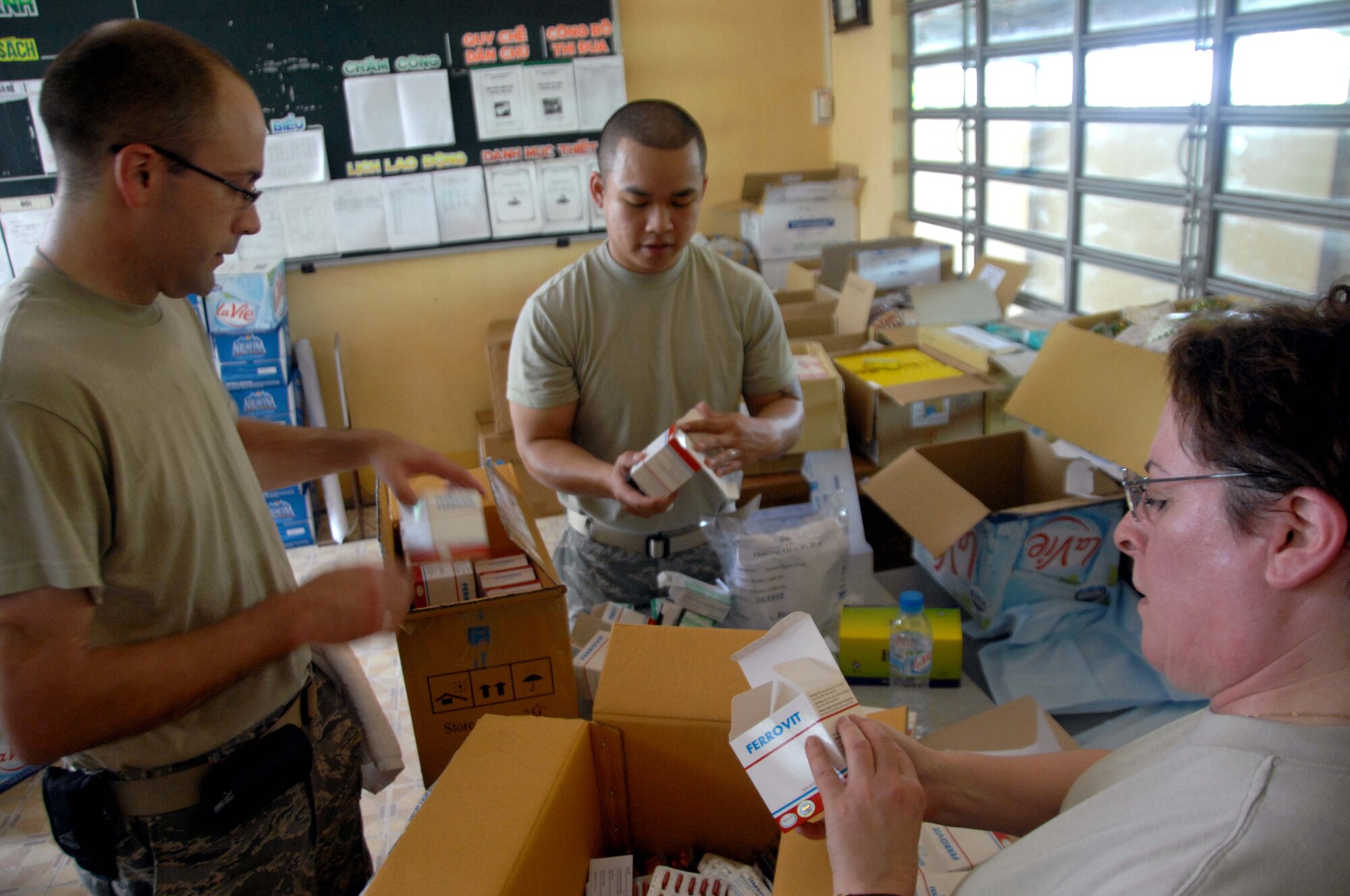 (Left to right) Staff Sgt. Clint Wagner, Airman First Class Hai Nguyen, Lt. Col. Cynthia Fry-Spray check and categorize medical supplies in Tan Thoi, Vietnam, as part of Pacific Angel 10-2.  The medical supplies will help support the medical clinic set up at the Tan Thoi Village Elementary School in a joint effort between the U.S. and Vietnam military and non-governmental agencies.  The clinic will help provide free services to include family practice, dental, optometry, pediatrics and women's health to Can Tho area residents May 10-17. Colonel Fry-Spray is deployed from the 446th Aeromedical Dental Squadron at McChord AFB, Wash.; Sergeant Wagner is deployed from the 911 ASTS at Pittsburgh Air Reserve Station, Pa.; and Airman Nguyen is deployed from the 3rd Medical Dental Squadron at Elmendorf AFB, Alaska. (U.S. Air Force photo/Capt. Timothy Lundberg)
