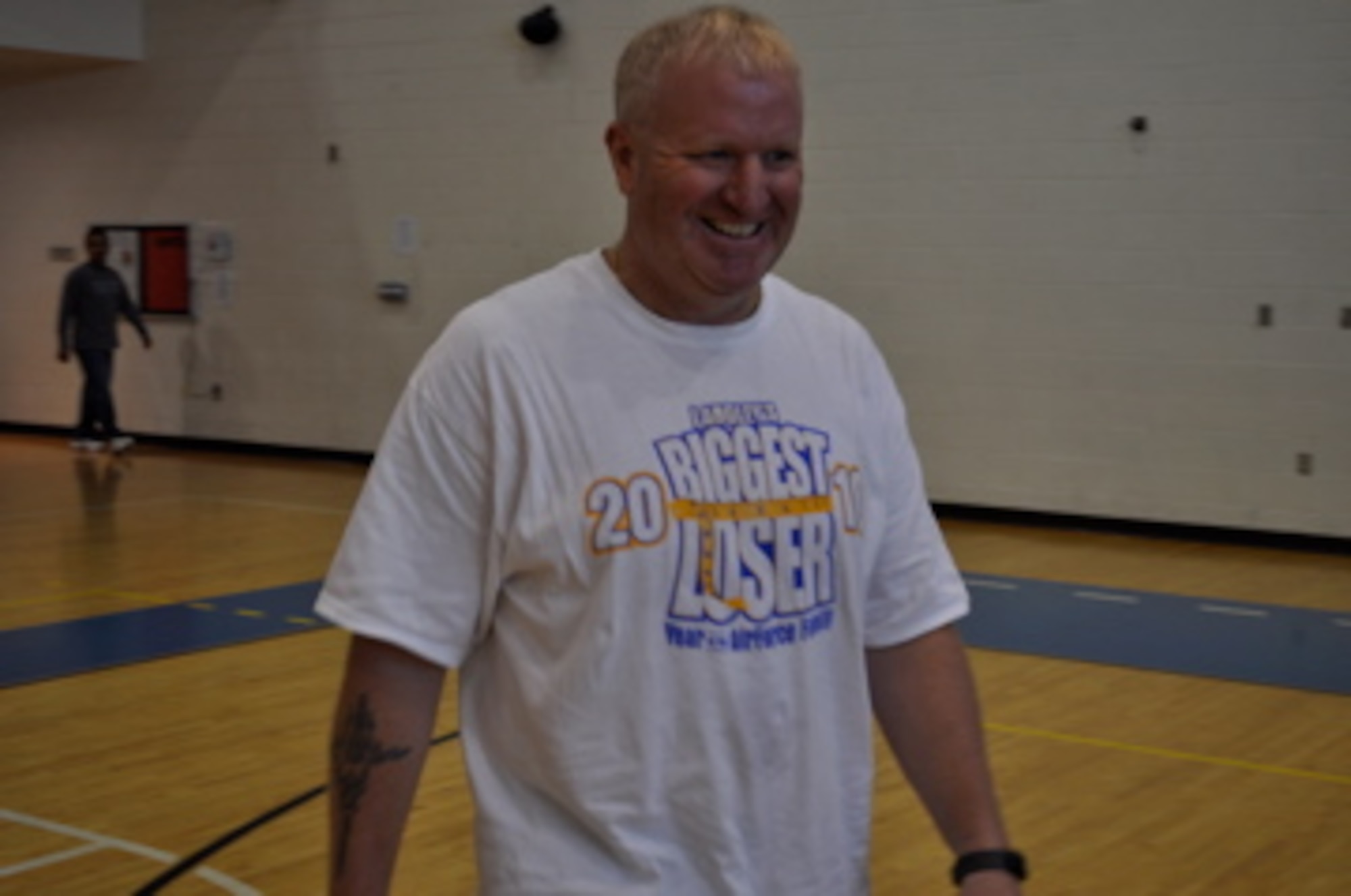 LANGLEY AIR FORCE BASE, Va. -- Senior Master Sgt. Kevin Drake, 735th Supply Chain Management Group first sergeant, smiles following his final weigh-in at the 2010 Langley's Biggest Loser finale. Drake took first place in the men's competition with a 23 percent weight loss. (Courtesy photo)