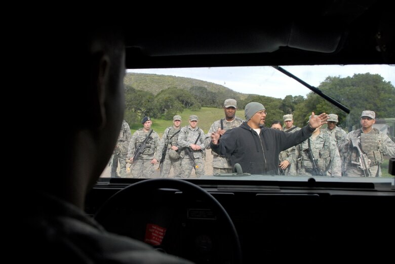 VANDENBERG AIR FORCE BASE, Calif. -- Chris Baltazar, a 30th Security Forces Squadron training instructor, reviews convoy tactical movements with 30th SFS Airmen participating in a combat readiness course here Tuesday, Feb. 23, 2010.  The training involved convoy tactics, defensive fighting positions and close-quarter battle situations.  (U.S. Air Force photo/Senior Airman Andrew Satran) 

 



 