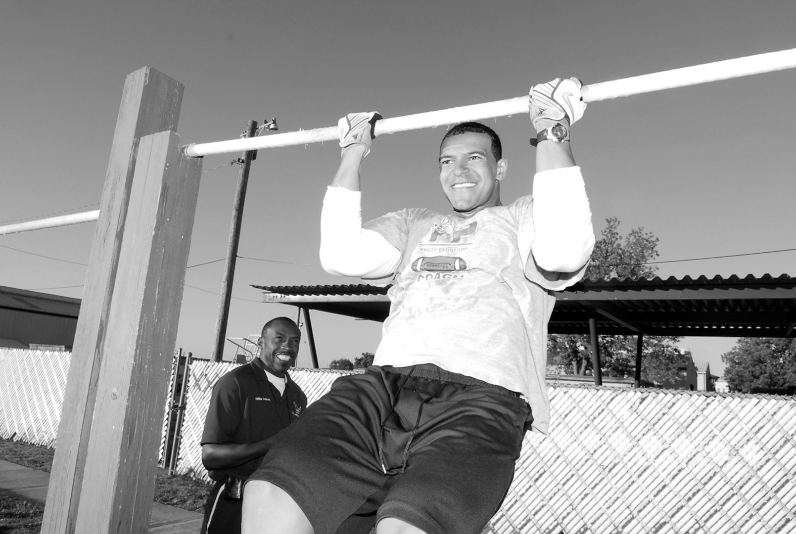 Chris Perry, Security Hill Personnel Center, participates in the pull-up contest at the Gillum Fitness Center, Tuesday. (U.S. Air Force photo by Alan Boedeker)