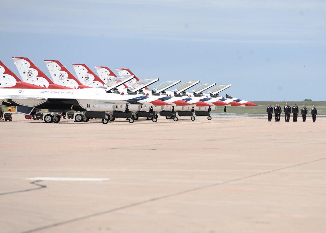 United States Air Force Thunderbirds approach their perspective Thunderbird aircraft during the Dyess Big Country Air Fest May 1, 2010, at Dyess Air Force Base, Texas. (U.S. Air Force photo/Airman 1st Class Brittney Prescott)