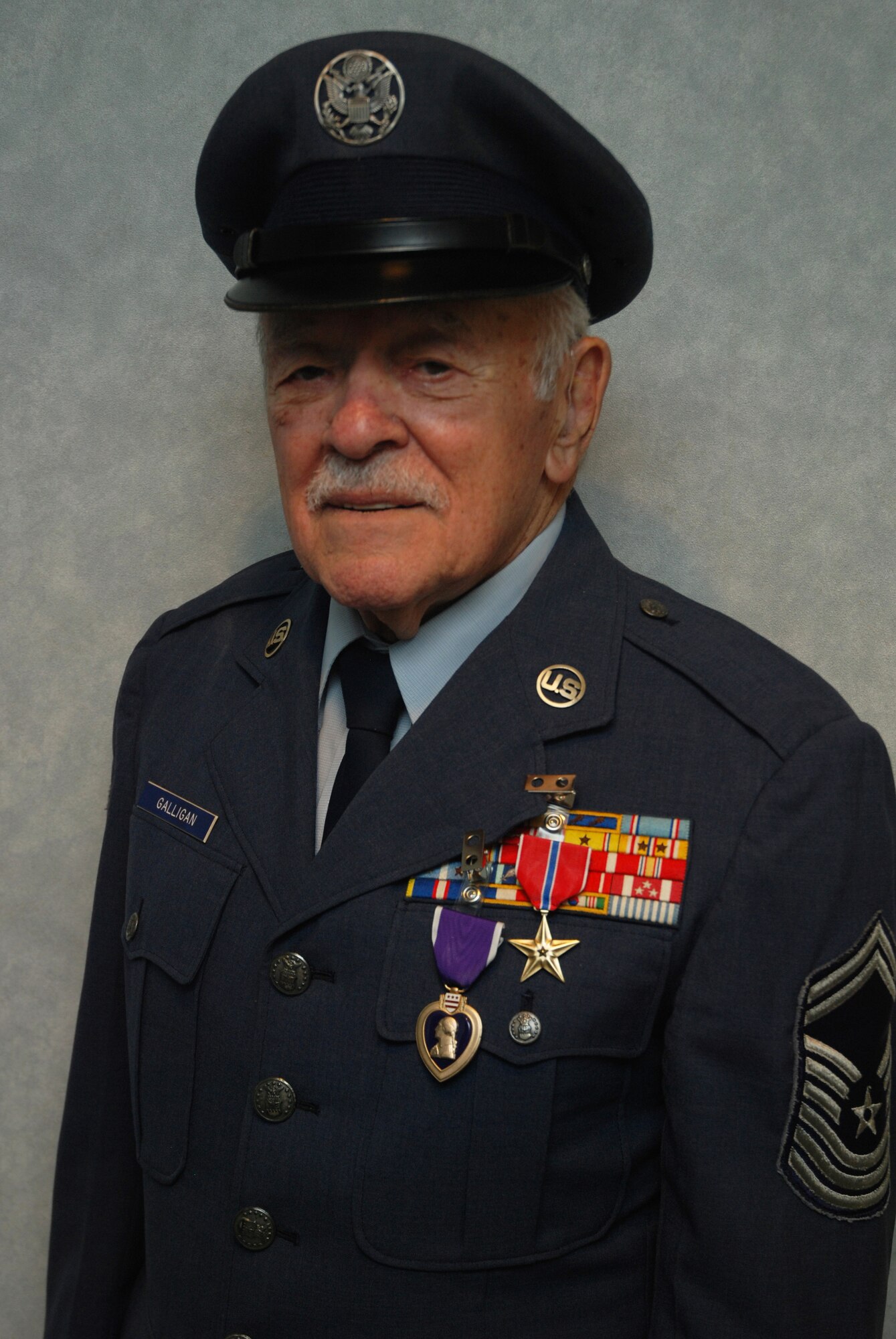 Chief Master Sgt. Francis Galligan is awarded the Bronze Star and Purple Heart at a ceremony held at the Westover Conference Center May 10.  The long-delayed medals recognize the Chief's actions during the Bataan Death March in World War II.