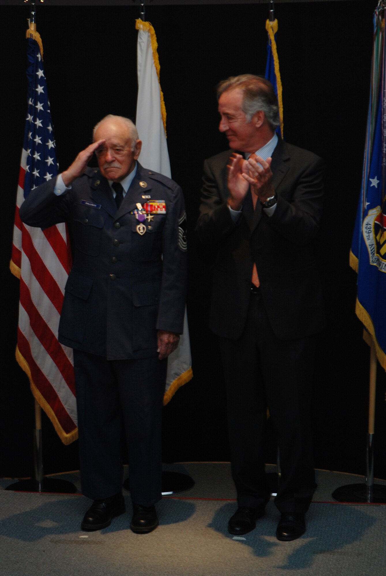 Chief Master Sgt. Francis Galligan is awarded the Bronze Star and Purple Heart at a ceremony held at the Westover Conference Center May 10.  The long-delayed medals recognize the Chief's actions during the Bataan Death March in World War II.