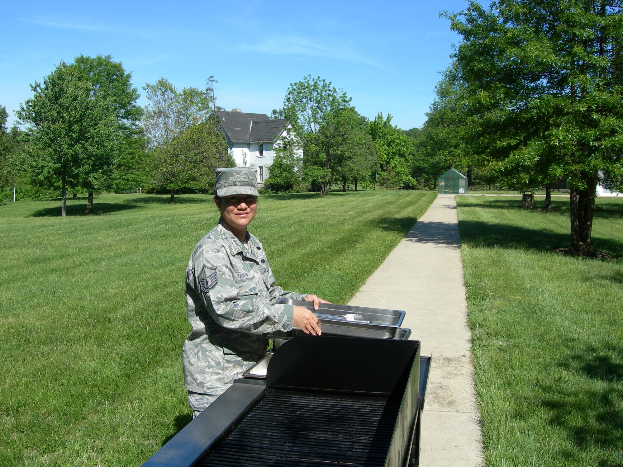Master Sgt. Rica Taylor Air Force District of Washington, NCOIC Knowledge Operator prepares for May Spring Cookout for the residents at the Armed Forces Retirement Home Washington, D.C., held on May 7, 2010. (U.S. photo by Aletha Frost)