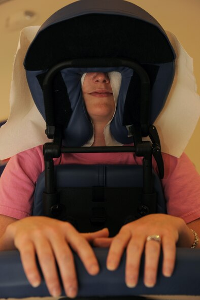 MOODY AIR FORCE BASE, Ga. -- Alisha Warren, military spouse, receives a free back massage during Spouses Appreciation Day here May 7. Several military members and spouses came to enjoy the free chair massages at the Base Exchange. (U.S. Air Force photo by Airman 1st Class Benjamin Wiseman/RELEASED)