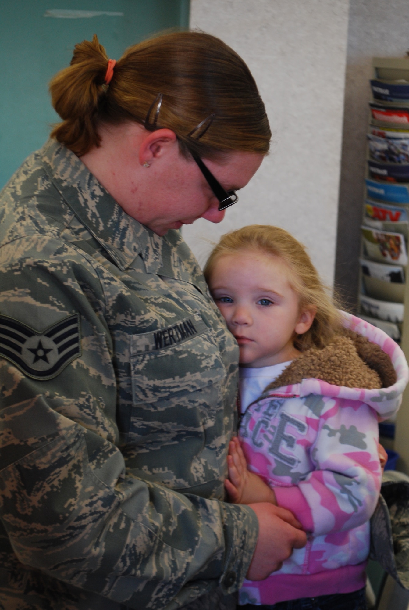 Staff Sgt. Janelle E. Wertman, 42nd Aerial Port Squadron, says goodbye to her three-year-old daughter before leaving for her first deployment.  Sergeant Wertman was one of about 15 aerial porters deploying to support the surge in Afghanistan.  (U.S. Air Force Photo by Tech. Sgt. Andrew Biscoe)