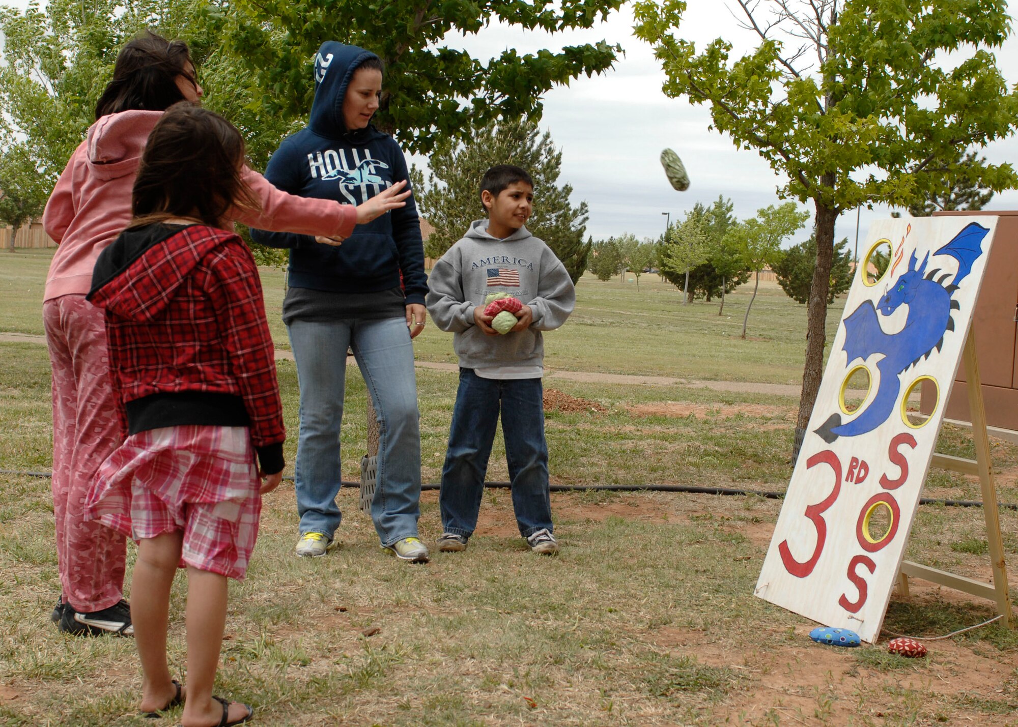 A ball toss set up by the 3rd Special Operations Squadron was one of the activities during the seventh annual Kite Karnival May 8. About 400 military and community members enjoyed the free event that also included train rides, bouncy castles, food and kites, of course. (Air Force photo by Greg Allen)