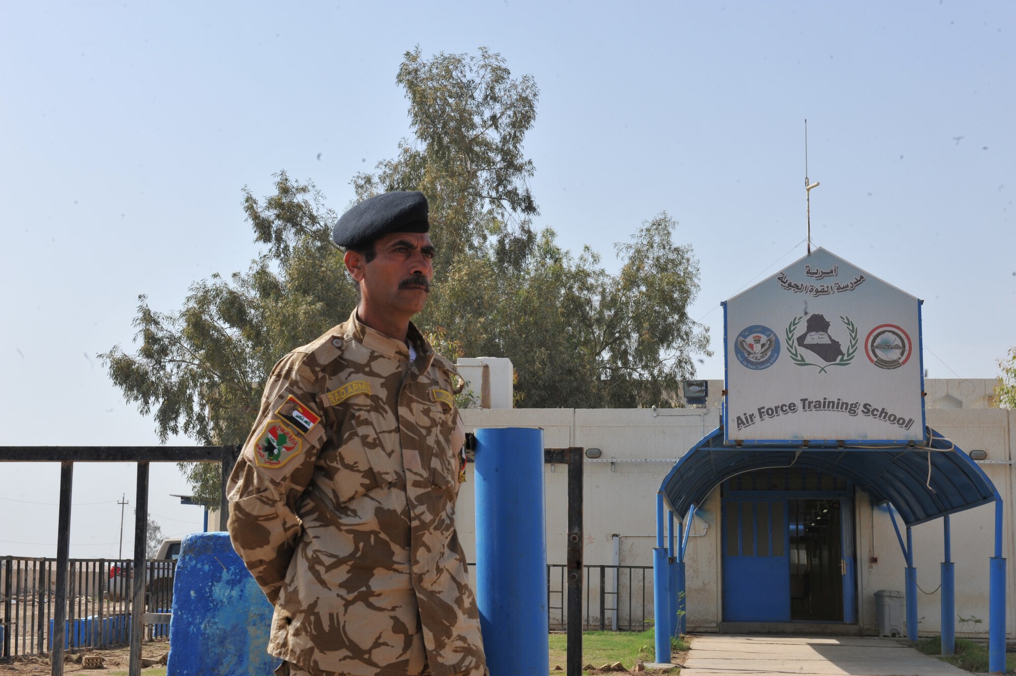 An Iraqi Air Force airman stands outside of the Iraqi Air Force Training School at Camp Taji, Iraq, April 19, 2010. The Iraqi airmen volunteered to return to active duty through the rehire program by the Ministry of Defense.  (U.S. Air Force photo/Staff Sgt Quinton Russ/released)