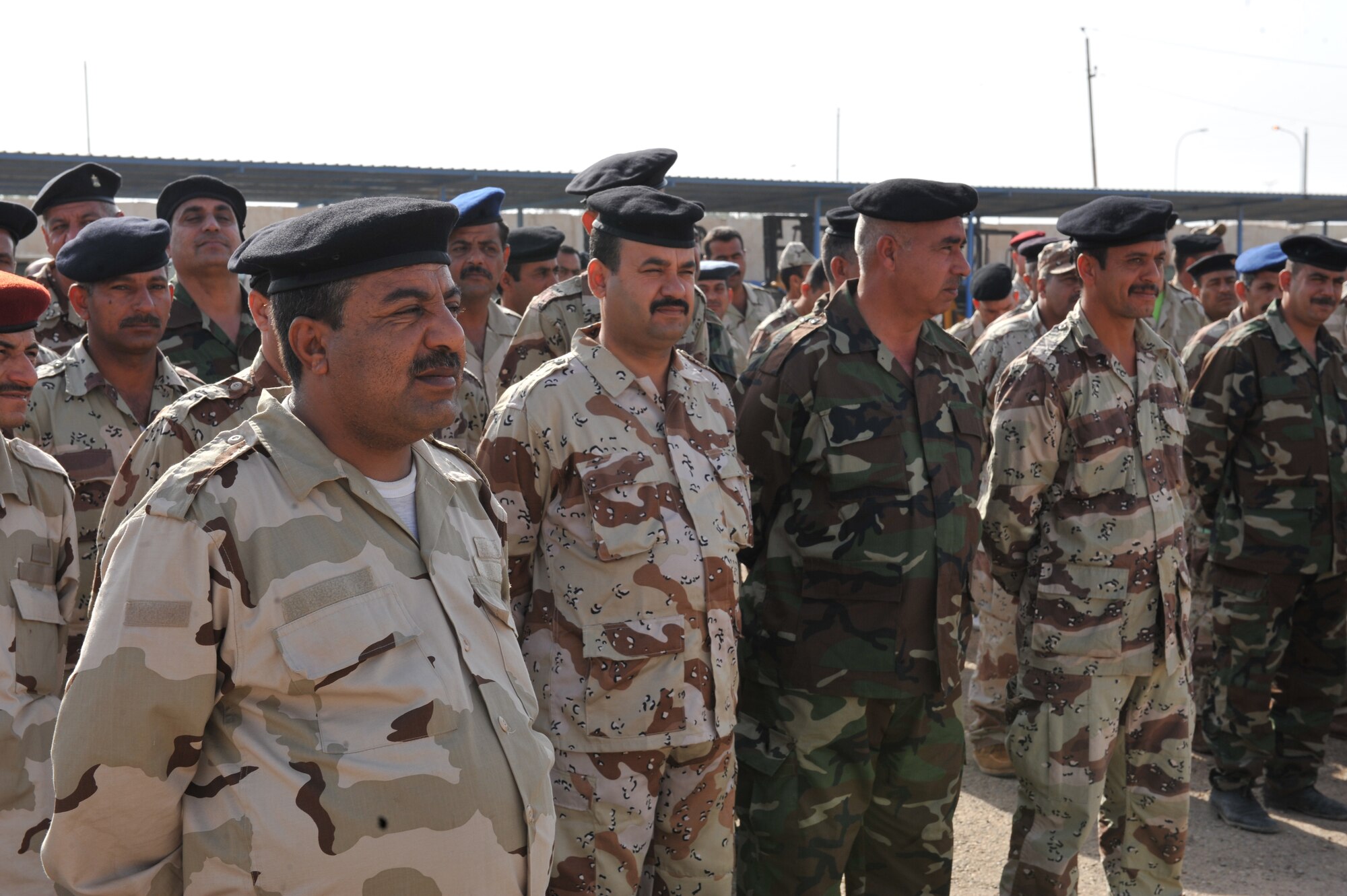 Iraqi Air Force members stand in formation for roll call at Camp Taji, Iraq, April 19, 2010. The Iraqi airmen volunteered to return to active duty through the rehire program by the Ministry of Defense.   (U.S. Air Force photo/Staff Sgt Quinton Russ/released)