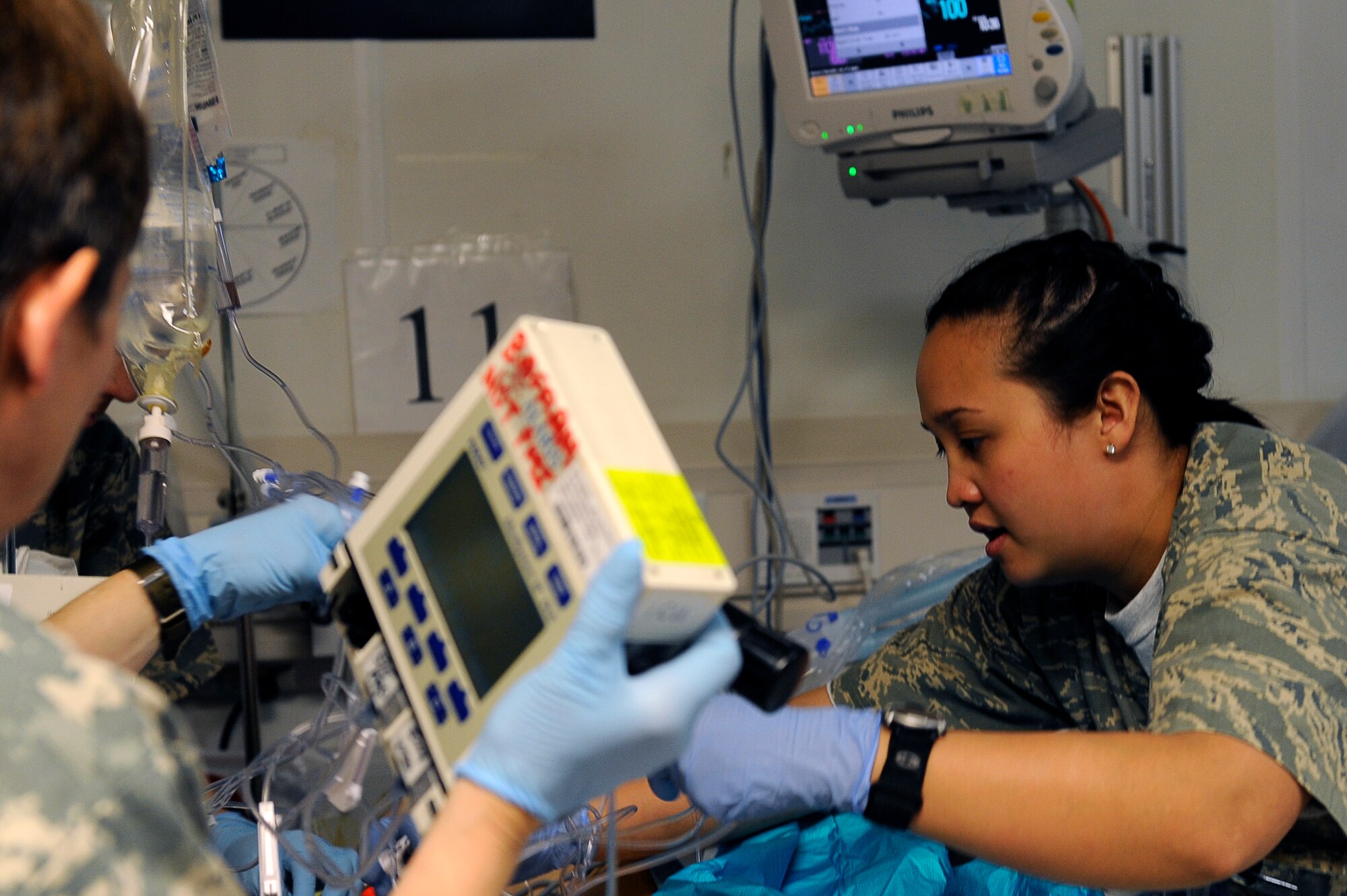 U.S. Air Force Senior Airman Jeazell Strait, 455th Expeditionary Medical Group/Task Force Medical East, provides medical care for a patient in the intensive care unit at the Craig Joint Theater Hospital, Bagram Airfield, Afghanistan, May 5, 2010. Airman Strait is deployed from Beale Air Force Base, Calif., and is from Mission Viejo, Calif. (U.S. Air Force photo by/ Master Sgt. Jeromy K. Cross/released)