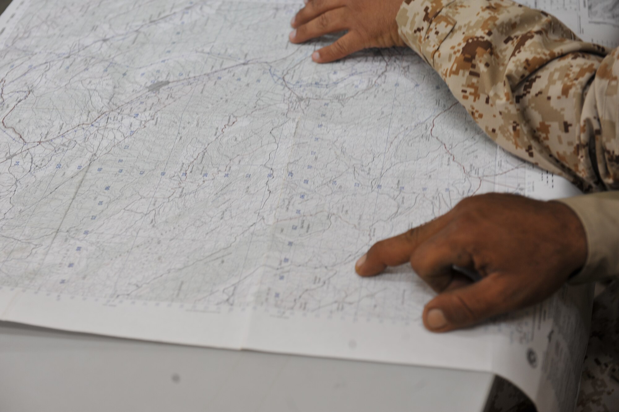 Iraqi Air Force airmen practice reading a map during the land-navigation portion of their BMT Top Off training at Camp Taji, Iraq on April 18, 2010. The Iraqi airmen volunteered to return to active duty through the rehire program by the Ministry of Defense.  (U.S. Air Force photo/Staff Sgt Quinton Russ/released)