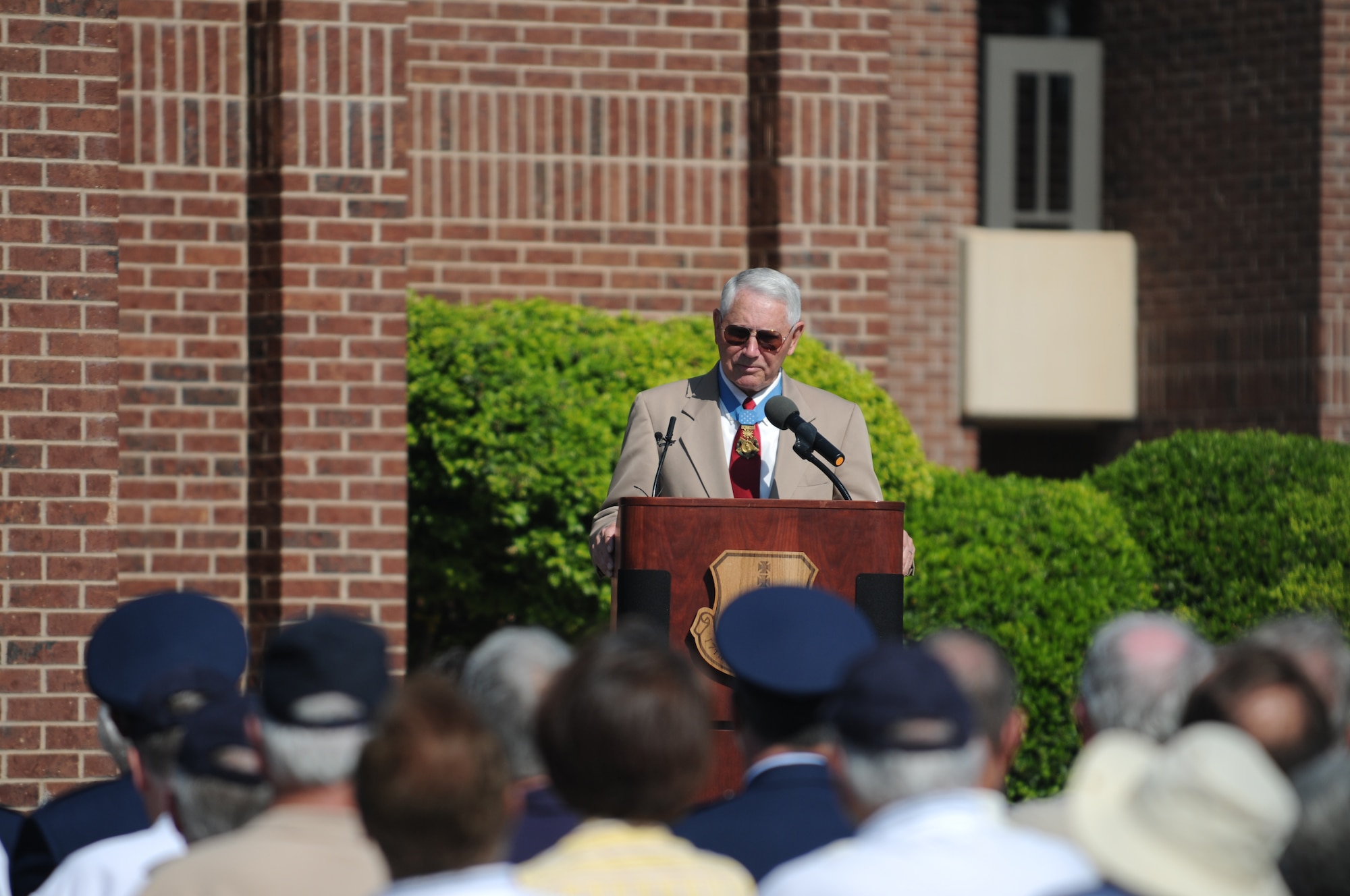 GOODFELLOW AIR FORCE BASE, Texas -- Medal of Honor recipient, retired Col. Leo K. Thorsness speaks at a building dedication ceremony, May 7, 2010. Two Visiting Officer Quarters were named in honor of Colonels Thorsness and George E. “Bud” Day. Both Air Force officers received the Medal of Honor for actions while serving in Vietnam. (U.S. Air Force photo/Airman 1st Class Clayton Lenhardt)