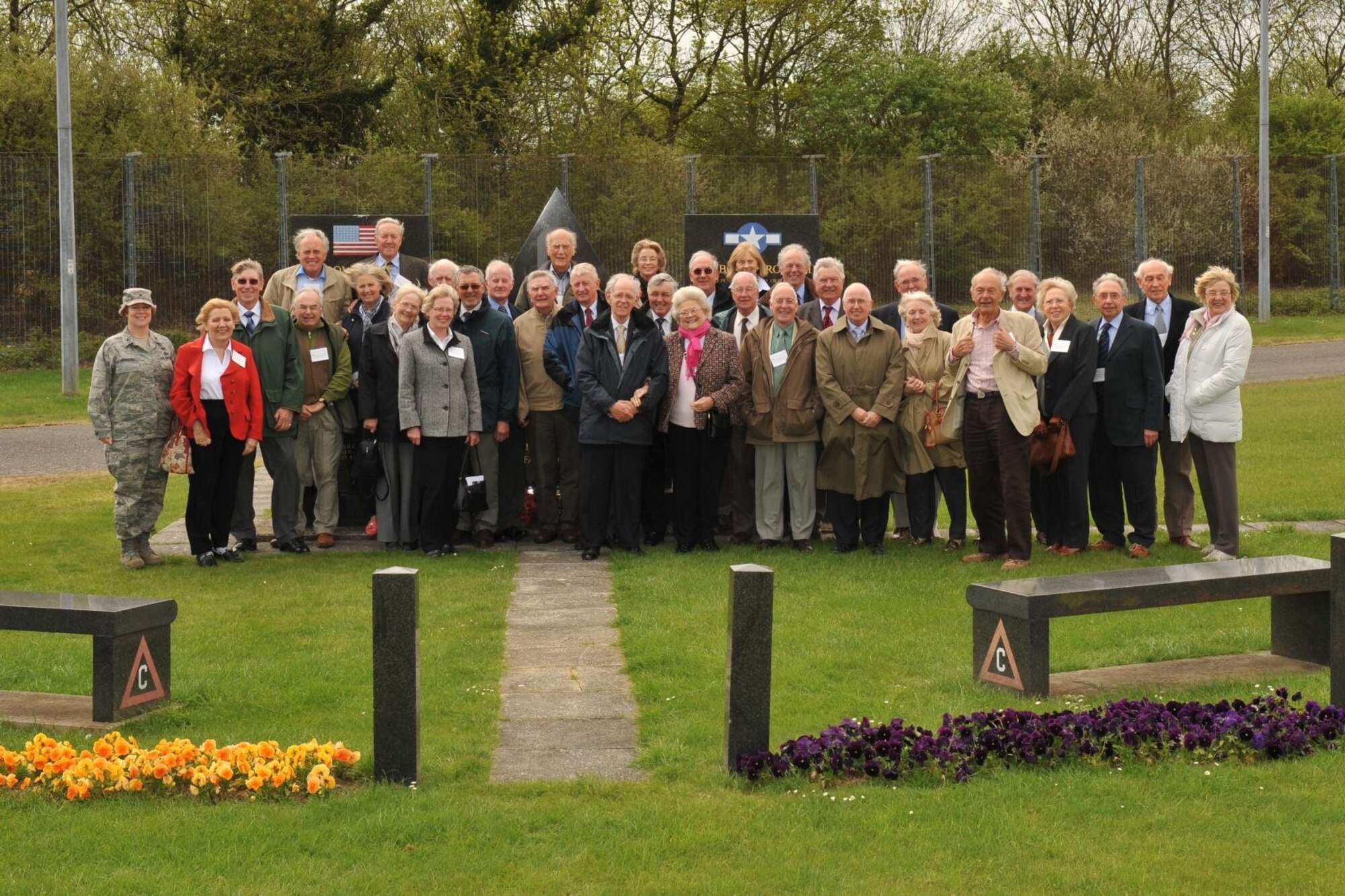 Members of the Peterborough PROBUS retired business group with their host, Colonel Amy A, Hammond, Commander, 423rd Air Base Group gather on May 6th at the RAF Molesworth memorial to the men of the World War II 303rd Bomb Group Heavy. (U.S. Air Force photo by Staff Sgt. Javier Cruz)