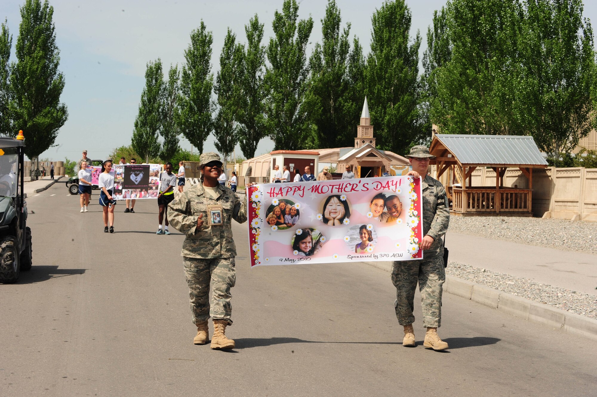 376th Air Expeditionary Wing military service members participate in a wing-wide parade in honor of Mother?s Day at the Transit Center at Manas, Kyrgyzstan, May 9,2010. (U.S. Air Force photo/ Senior Airman Nichelle Anderson/released)