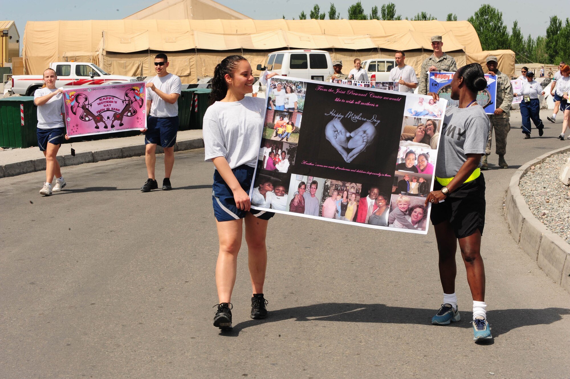 376th Air Expeditionary Wing military service members participate in a wing-wide parade in honor of Mother?s Day at the Transit Center at Manas, Kyrgyzstan, May 9,2010. (U.S. Air Force photo/ Senior Airman Nichelle Anderson/released)