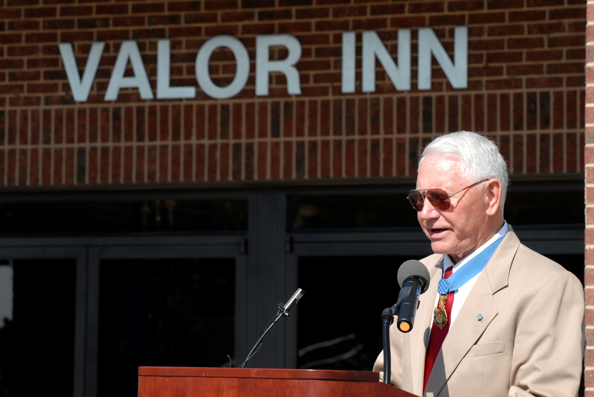 Medal of Honor recipient Col. Leo Thorsness speaks during a dedication ceremony of two buildings in honor of himself and fellow Medal of Honor recipient Col.  George E. “Bud” Day May 7 on Goodfellow AFB, Texas.  (U.S. Air Force photo/Master Sgt. Randy Mallard)