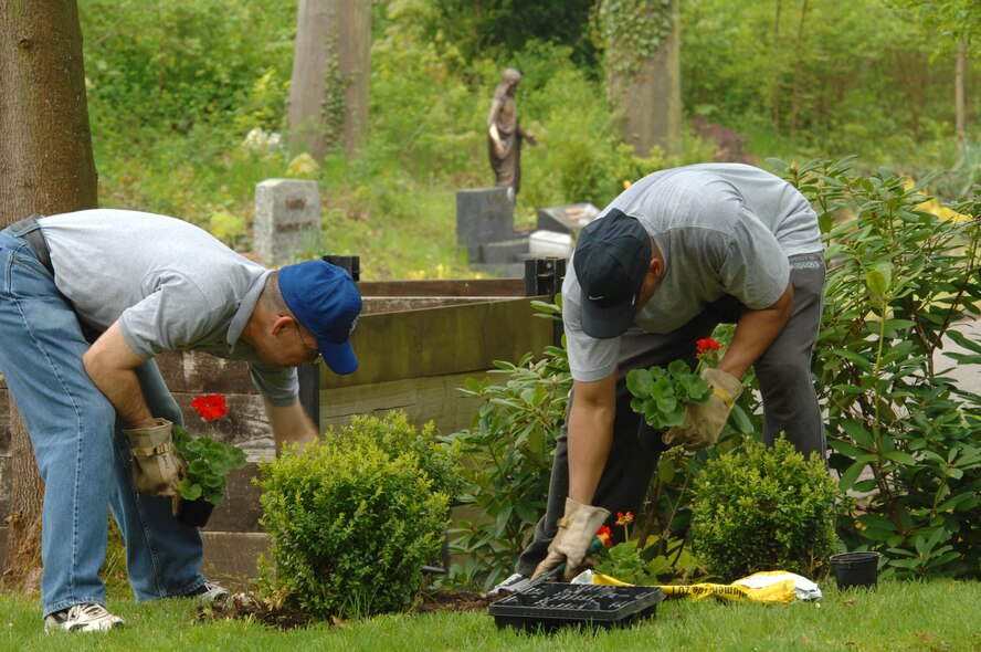 (Left to right) U.S. Air Force Chief Master Sgt. Kent McCormack, 86th Dental Squadron superintendent and Chief Master Sgt. Danny Crudup, 24th Intelligence Squadron tend to the grounds of the Kaiserslautern Kindergraves Memorial Cemetery in preparation for a yearly remembrance ceremony.The 2010 Kindergraves memorial ceremony will take place May 15 at 10 a.m. at the U.S. Army Daenner Kaserne Chapel. (Air Force photo by Tech. Sgt. Michael Voss)