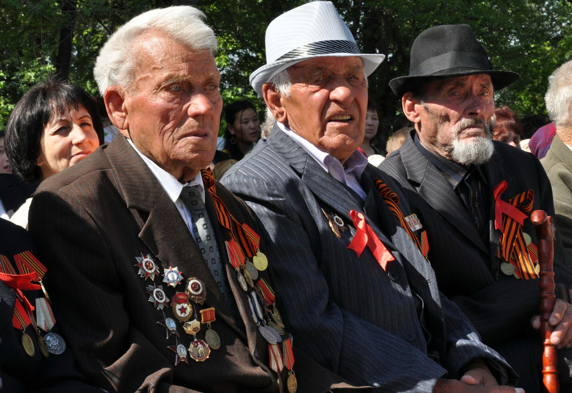 Three veterans of the Great Patriotic War (WWII) watch the Victory Day ceremony in Manas Village, Kyrgyzstan, May 9, 2010. The mayor invited Col. Blaine Holt and Chief Master Sgt. James Dowell, the director and command chief for the Transit Center at Manas, to participate in the celebration of the end of the Nazi regime. During the event, a memorial wall was unveiled, with about 50 names etched in stone of Manas patriots who died during the war. (U.S. Air Force photo/Staff Sgt. Carolyn Viss)