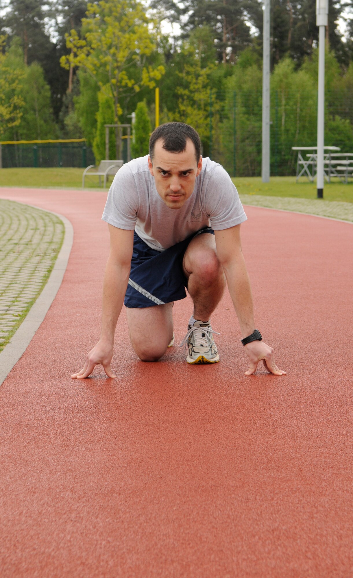 U.S. Air Force Capt. Claude Poole, 3rd Air Force Execution Plans Branch chief, scored a perfect 100 percent on his Air Force Fitness Assesment for the month of April. He attributes staying active and watching what he eats for helping him achieve the score. (U.S. Air Force photo by Airman 1st Class Brittany Perry)