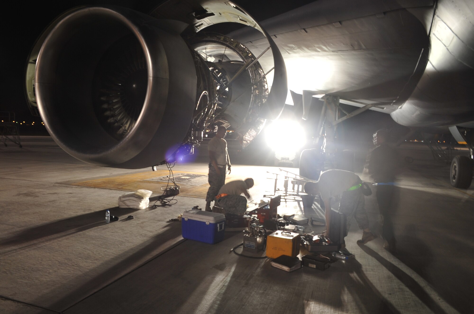 Maintenance Airmen from the 380th Expeditionary Aircraft Maintenance Squadron's Extender aircraft maintenance unit work on a KC-10 Extender during operations for the 380th Air Expeditionary Wing at a non-disclosed base in Southwest Asia on May 1, 2010.  The 380th EAMXS, as part of the 380th AEW, supports operations Iraqi Freedom and Enduring Freedom and the Combined Joint Task Force-Horn of Africa. (U.S. Air Force Photo/Master Sgt. Scott T. Sturkol/Released)