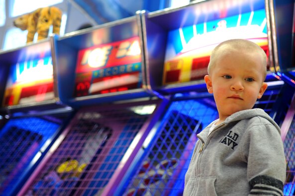 Niko Saldukas, son of Senior Airman Scott Saldukas, prepares to play a game at the 'Kid Zone' on Pulaski Barracks, Germany, May 4, 2009. The 'Kid Zone' reopened April 17 after a six-month renovation process to modernize the center. 