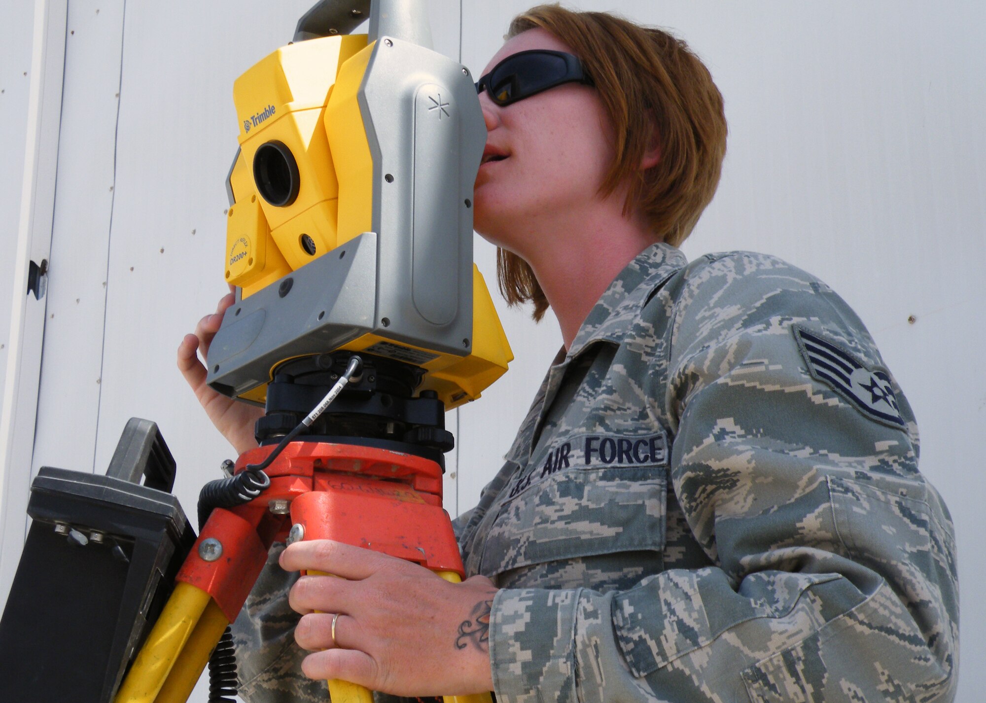Staff Sgt. Jammie Catoe, engineering journeyman or engineering assistant with the 380th Expeditionary Civil Engineer Squadron, uses surveying equipment during operations for the 380th Air Expeditionary Wing at a non-disclosed base in Southwest Asia on May 8, 2010. Sergeant Catoe is deployed from the 20th Civil Engineer Squadron at Shaw Air Force Base, S.C., and her hometown is Lancaster, S.C. (U.S. Air Force Photo/Staff Sgt. Nathan D. Delgado/Released)