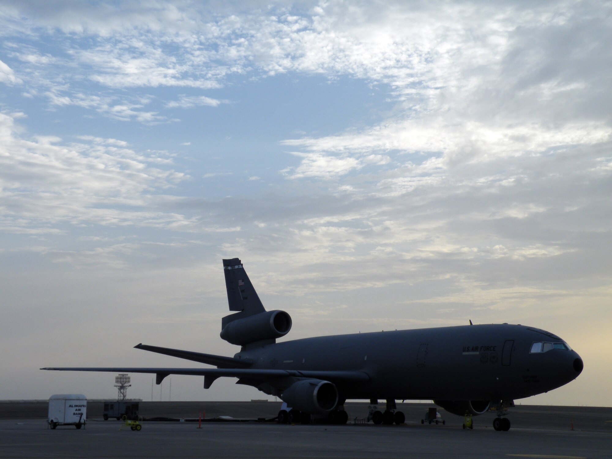 A KC-10 Extender from the 908th Expeditionary Air Refueling Squadron is silouetted as the sun sets during operations for the 380th Air Expeditionary Wing on the flightline May 6, 2010, at a non-disclosed base in Southwest Asia. In the first three months of 2010, Airmen supporting the KC-10 deployed air refueling mission in the U.S. Central Command area of responsibility flew more than 1,000 sorties offl-loading more than 108 million pounds of fuel to more than 6,600 aircraft in support of combat operations. The 908th EARS, as part of the 380th Air Expeditionary Wing, support operations Iraqi Freedom and Enduring Freedom and the Combined Joint Task Force-Horn of Africa. (U.S. Air Force Photo/Staff Sgt. Nathan D. Delgado/Released)
