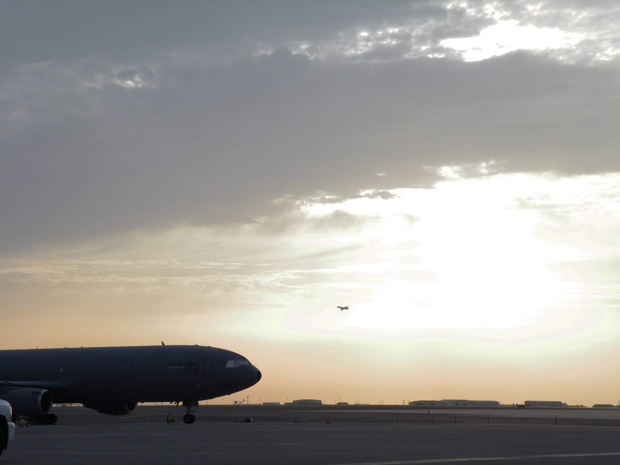 A KC-10 Extender from the 908th Expeditionary Air Refueling Squadron is silouetted as the sun sets during operations for the 380th Air Expeditionary Wing on the flightline May 6, 2010, at a non-disclosed base in Southwest Asia. In the first three months of 2010, Airmen supporting the KC-10 deployed air refueling mission in the U.S. Central Command area of responsibility flew more than 1,000 sorties offl-loading more than 108 million pounds of fuel to more than 6,600 aircraft in support of combat operations. The 908th EARS, as part of the 380th Air Expeditionary Wing, support operations Iraqi Freedom and Enduring Freedom and the Combined Joint Task Force-Horn of Africa. (U.S. Air Force Photo/Staff Sgt. Nathan D. Delgado/Released)
