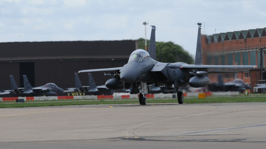 RAF MILDENHALL, England – An F-15E Strike Eagle from the 492nd Fighter Squadron at RAF Lakenheath taxis along the flightline here May 4. Over the next few weeks, various aircraft will temporarily relocate from RAF Lakenheath to RAF Mildenhall in preparation for the airfield repairs at RAF Lakenheath. The construction is expected to take about one month to complete. (U.S. Air Force photo/Staff Sgt. Thomas Trower)