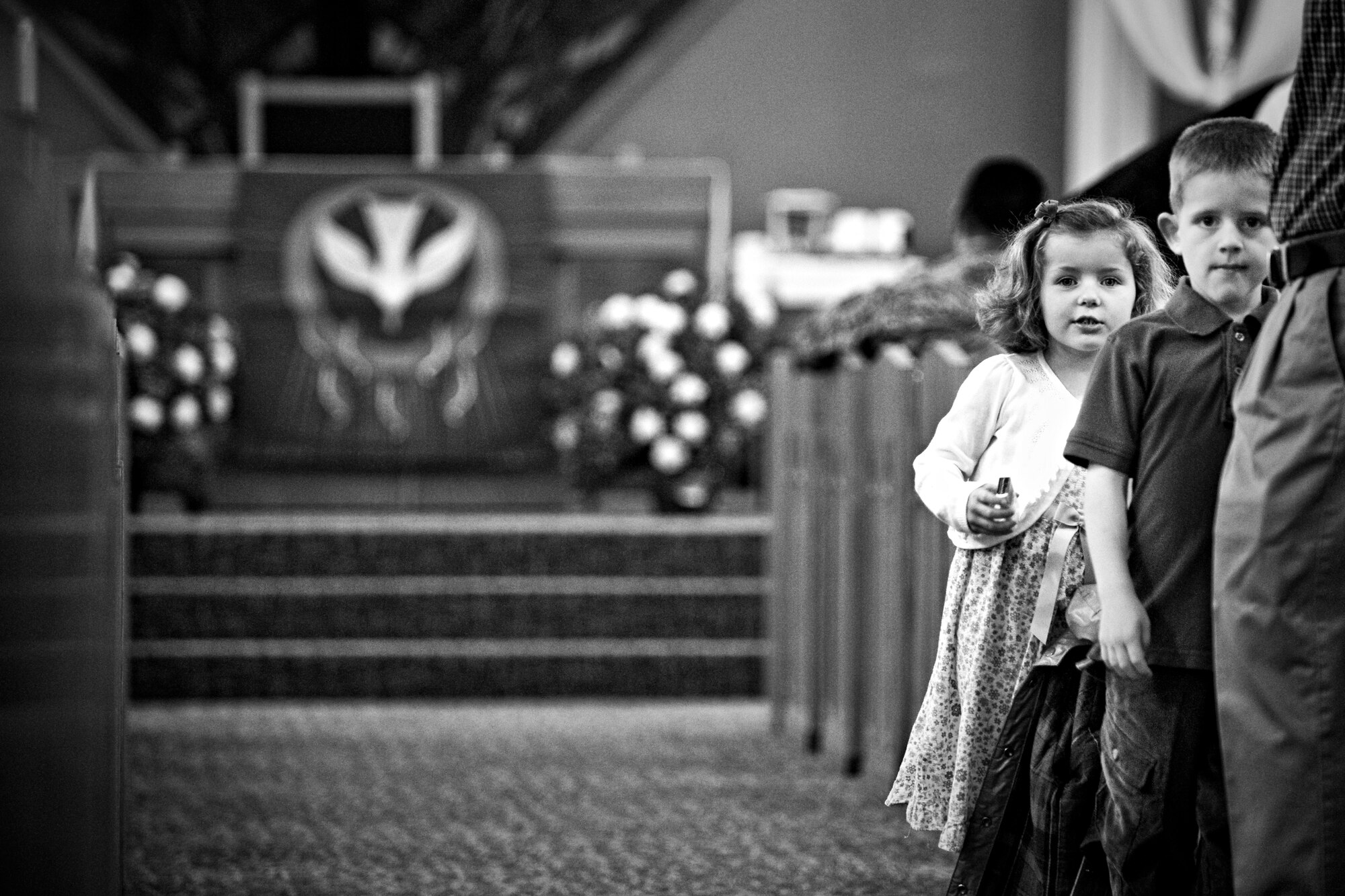 MISAWA AIR BASE, Japan -- Javen Beardsley and Olivia Miller watch before the beginning of Misawa's 2010 Confirmation Mass May 6 at the base chapel. Javen is the son of Master Sgt. Jason Beardsley, 35th Security Forces Squadron first sergeant, and Olivia is the daughter of Senior Master Sgt. William Miller, 35th Fighter Wing deputy inspector general. (U.S. Air Force photo/Senior Airman Jamal D. Sutter)