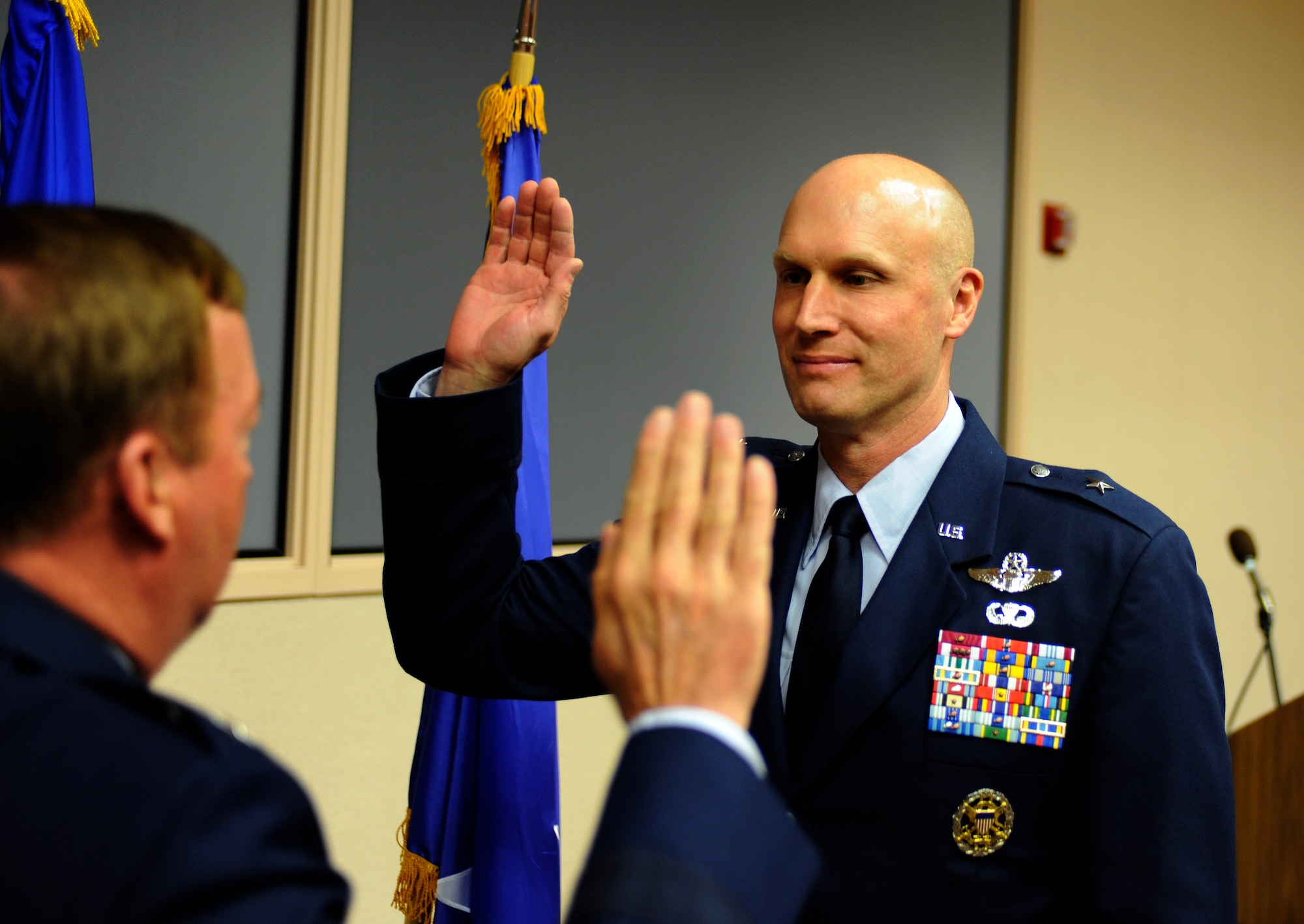 Lt. Gen. Dana T. Atkins administers the oath of office to Brig.Gen. James N. Post III May 10, 2010, Eielson Air Force Base. The promotion ceremony took place at the 353rd Combat Training Squadron. General Atkins is the 11th Air Force Commander. General Post is the 354th Fighter Wing Commander. (U.S. Air Force photo by Willard Grande  III)