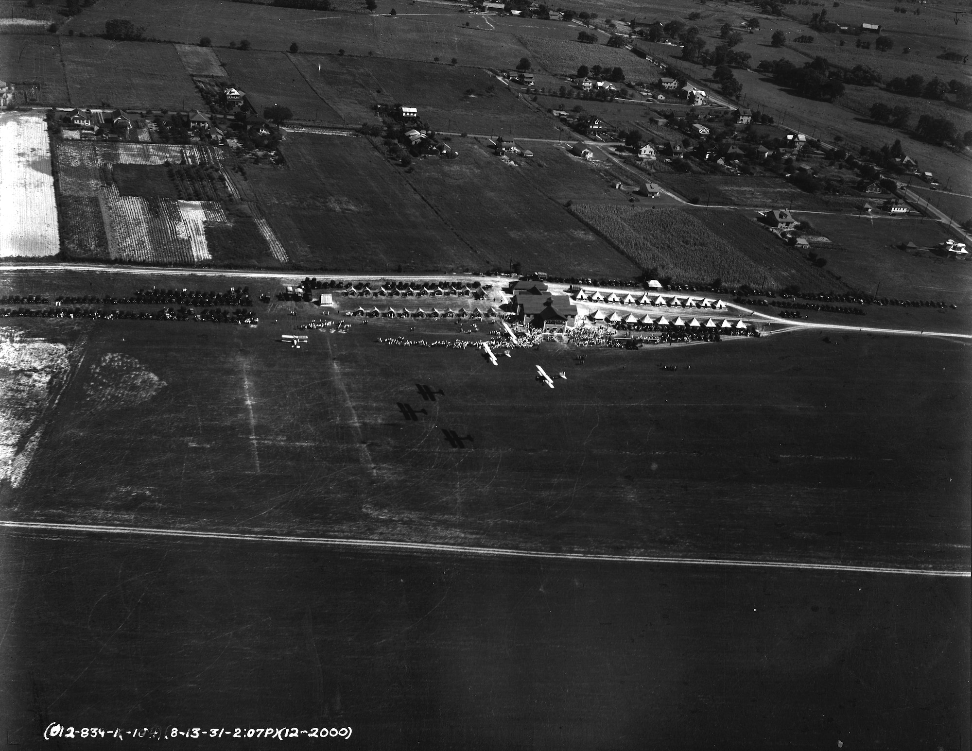 A formation of three O-38 aircraft belonging to the Maryland National Guard's 104th Observation Squadron fly over Detrick Field, in Frederick, Md., Aug. 13, 1931. Detrick Field, which later became Fort Detrick, Md., was named in honor of Dr. (Capt.) Fredrick Detrick, the squadron's flight surgeon, who died in June 1931. (Released)