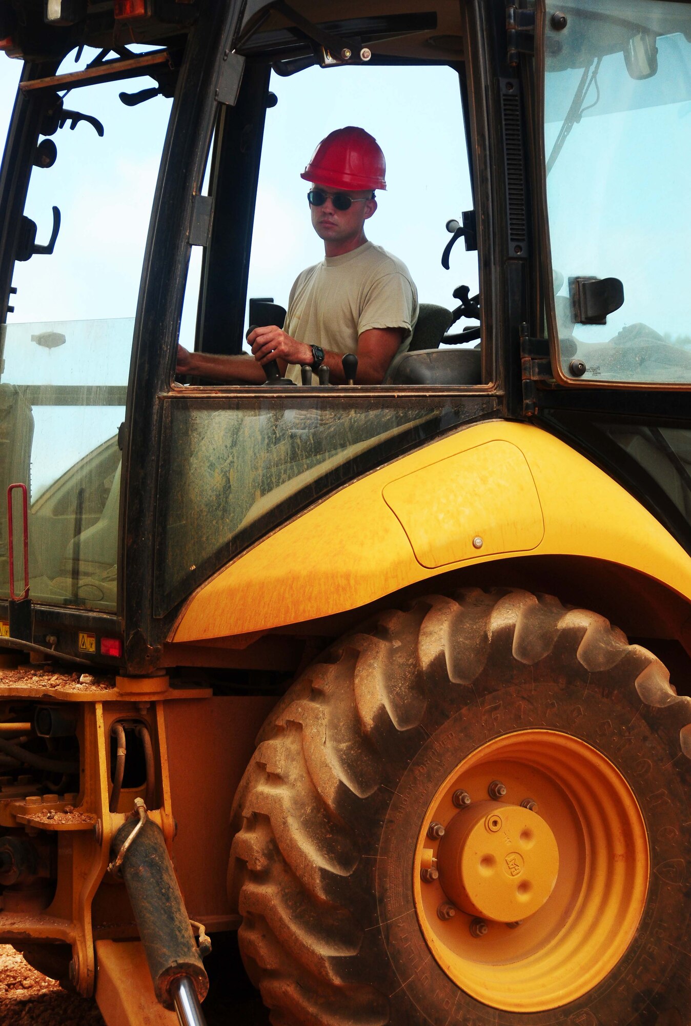 ANDERSEN AIR FORCE BASE, Guam - Staff. Sgt Derrick Ross, 554th Red Horse Squadron pavements and construction equipment craftsman, backfills a construction site at the Pacific Air Forces Regional Training Center, here May 10. Sergeant Ross was recently recognized as a 'Top Performer' by the 554th RHS first sergeant. (U.S. Air Force photo by Airman 1st Class Jeffrey Schultze)