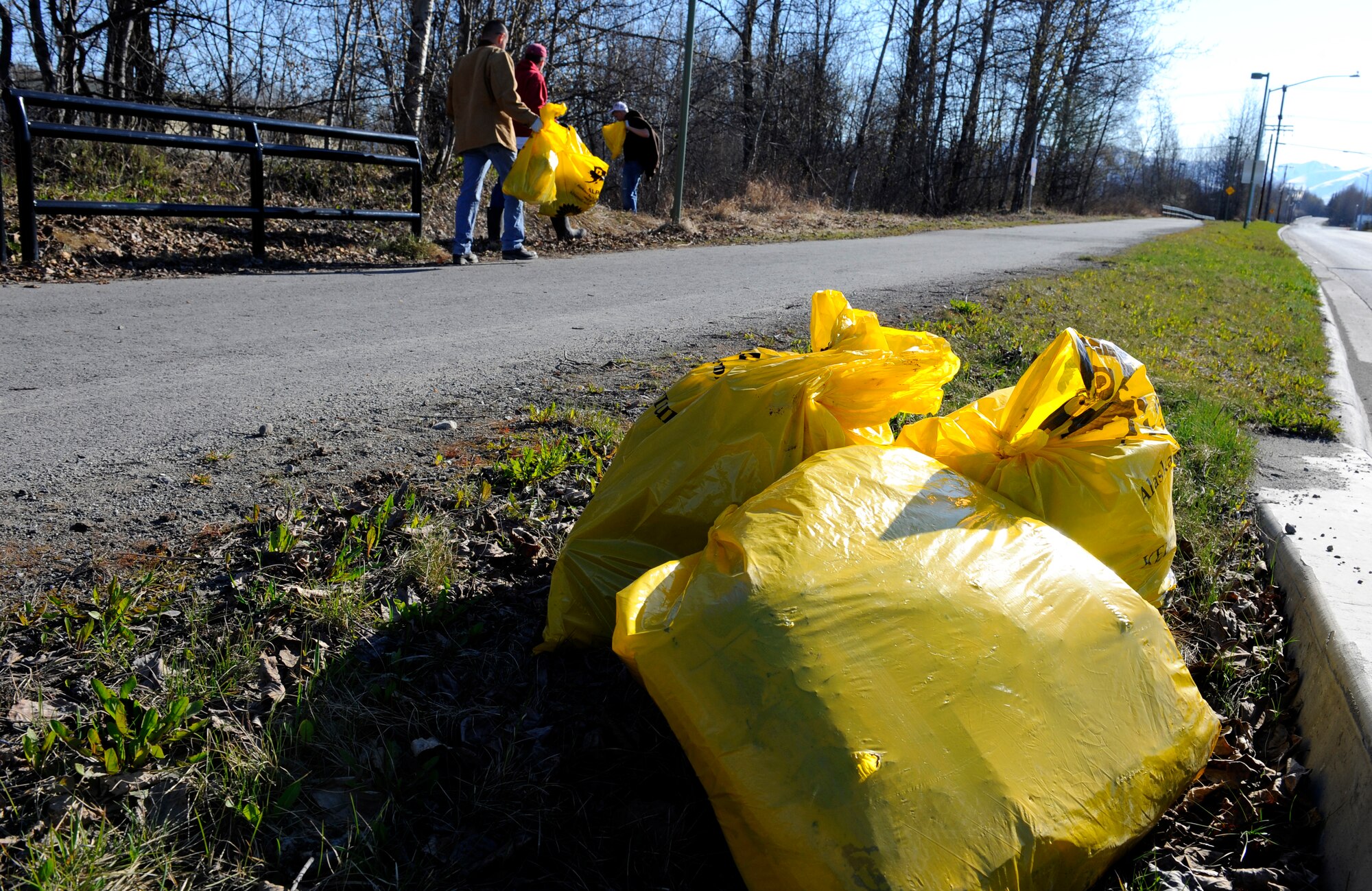 Airmen from the 525th Aircraft Maintenance Unit, Elmendorf Air Force Base, Alaska, pick up trash along Ship Creek during the 26th Annual Creek Cleanup May 8. The event was sponsored by The Anchorage Alaska Waterways and The Municipality of Anchorage. (Air Force photo by Staff Sgt. Brian Ferguson)