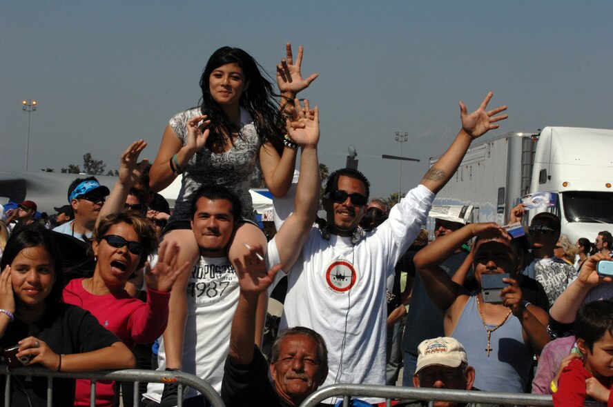 Crowd members enjoy their time watching performances at the March Field AirFest, March Air Reserve Base, Calif., May 2, 2010. The AirFest is a bi-annual, two-day event featuring military and civilian aerial performances and static displays of modern and historic aircraft. (U.S. Air Force photo by Staff Sgt. Angel Gallardo/Released)