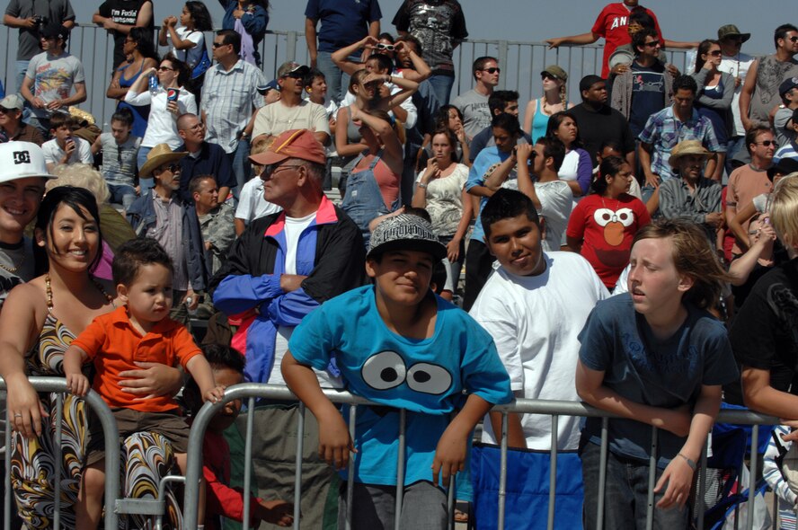 Audience members enjoy the performances at the March Field AirFest, March Air Reserve Base, Calif., May 2, 2010. The AirFest is a bi-annual, two-day event featuring military and civilian aerial performances and static displays of modern and historic aircraft. (U.S. Air Force photo by Staff Sgt. Angel Gallardo/Released)
