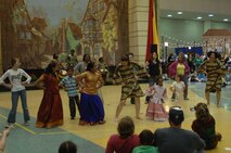 ST. PAUL, Minn. – The Duniya drum and dancers lead a crowd of spectators in dance during the Festival of Nations held at the Saint Paul RiverCentre here April 30. The Festival of Nations is the largest and longest running multicultural festival in Minnesota. It involves more than 90 different nationalities from around the world. (U.S. Air Force photo by Airman 1st Class Aaron-Forrest Wainwright)