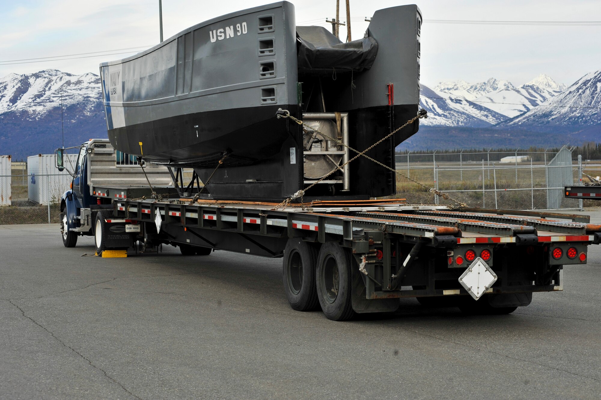 ELMENDORF AIR FORCE BASE, Alaska – A Navy boat skimmer sits on a flatbed, May 10, ready to be flown out the morning of May 11. Airmen from Elmendorf worked hard to gather and load oil containment equipment that was flown to New Orleans Naval Air Station. Several squadrons participated in providing relief support for the Gulf oil spill. “I’m extremely excited to support this mission. The nature of this equipment, and the responsibility to ensure it is air-worthy, has presented our squadron with several new and unique challenges,” said Mike Boy, 3rd Logistics Readiness Squadron installation deployment officer. “Up to this point, we have inspected, palletized and loaded over 100 tons of equipment belonging to BP Exploration (Alaska) and the U.S. Navy SUBSAL located on Fort Richardson.” (Air Force photo by Airman 1st Class Christopher Gross)