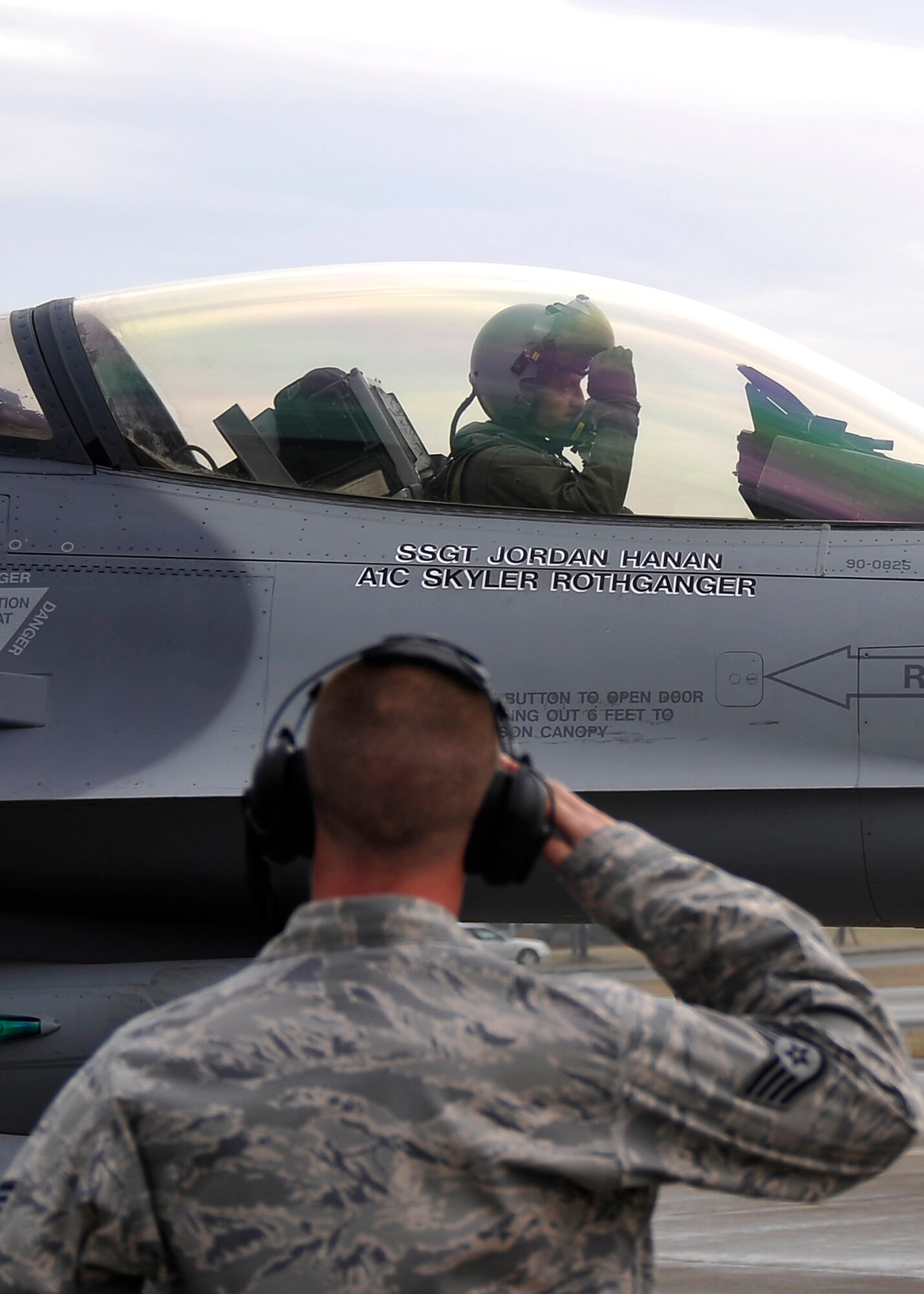MISAWA AIR BASE, Japan -- Staff Sgt. Gregory Meyers, 14th Aircraft Maintenance Unit crew chief, salutes Lt. Col. Aaron Steffens, 14th Fighter Squadron commander, after completing the pre-flight inspection May 7. Sixteen F-16 Fighting Falcons from the 14th FS deployed to the Republic of Korea in an effort to maintain regional stability. (U.S. Air Force photo/Staff Sgt. Chad C. Strohmeyer)