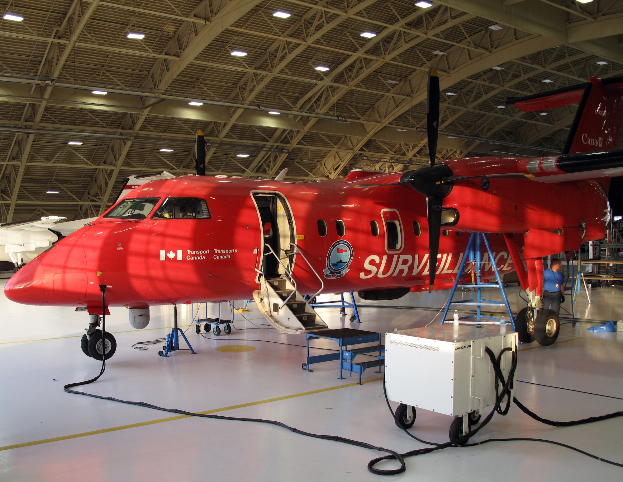 A Transport Canada Dash-8 100 series aircraft assigned to Canada's National Aerial Surveillance Program awaits repairs in Hangar 5 at Tyndall Air Force Base, Fla. May 5.  (U.S. Air Force Courtesy Photo)