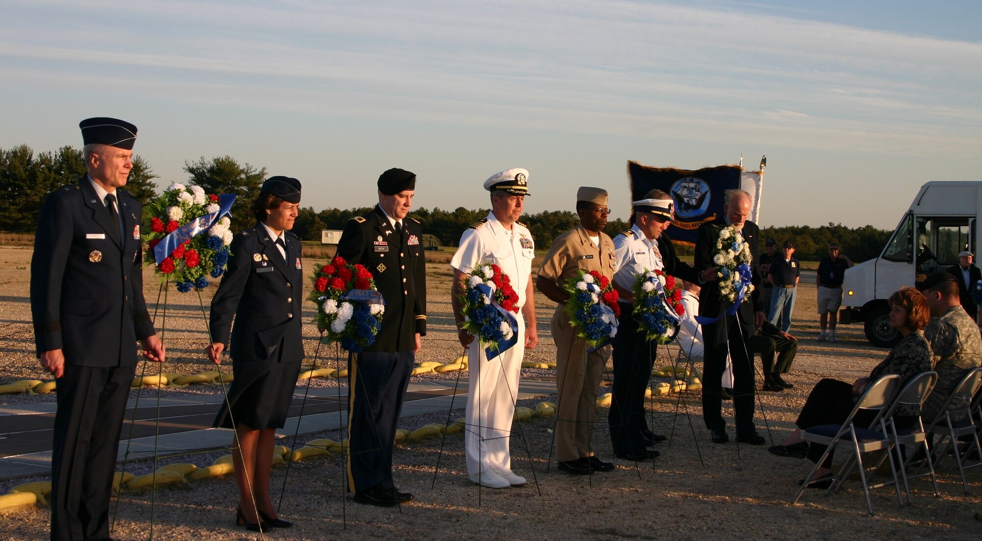Joint Base McGuire-Dix-Lakehurst leadership pays respects at a ceremony commemorating the 73rd anniversary of the Hindenburg disaster Monday. JB MDL and the Navy Lakehurst Historical Society hosted a traditional wreath-laying ceremony honoring the men and women from all branches of service who lost their lives in combat and in airship disasters. In honor of the commemoration ceremony, Lakehurst gates were open to the public for the first time since Sept. 11, 2001. More than 250 guests attended the ceremony to pay their respects. The ceremony was held in the exact spot the Hindenburg airship burned and crashed in the open field west of Hangar One May 6, 1937. (U.S. Navy photo/Pattie Odoardo)