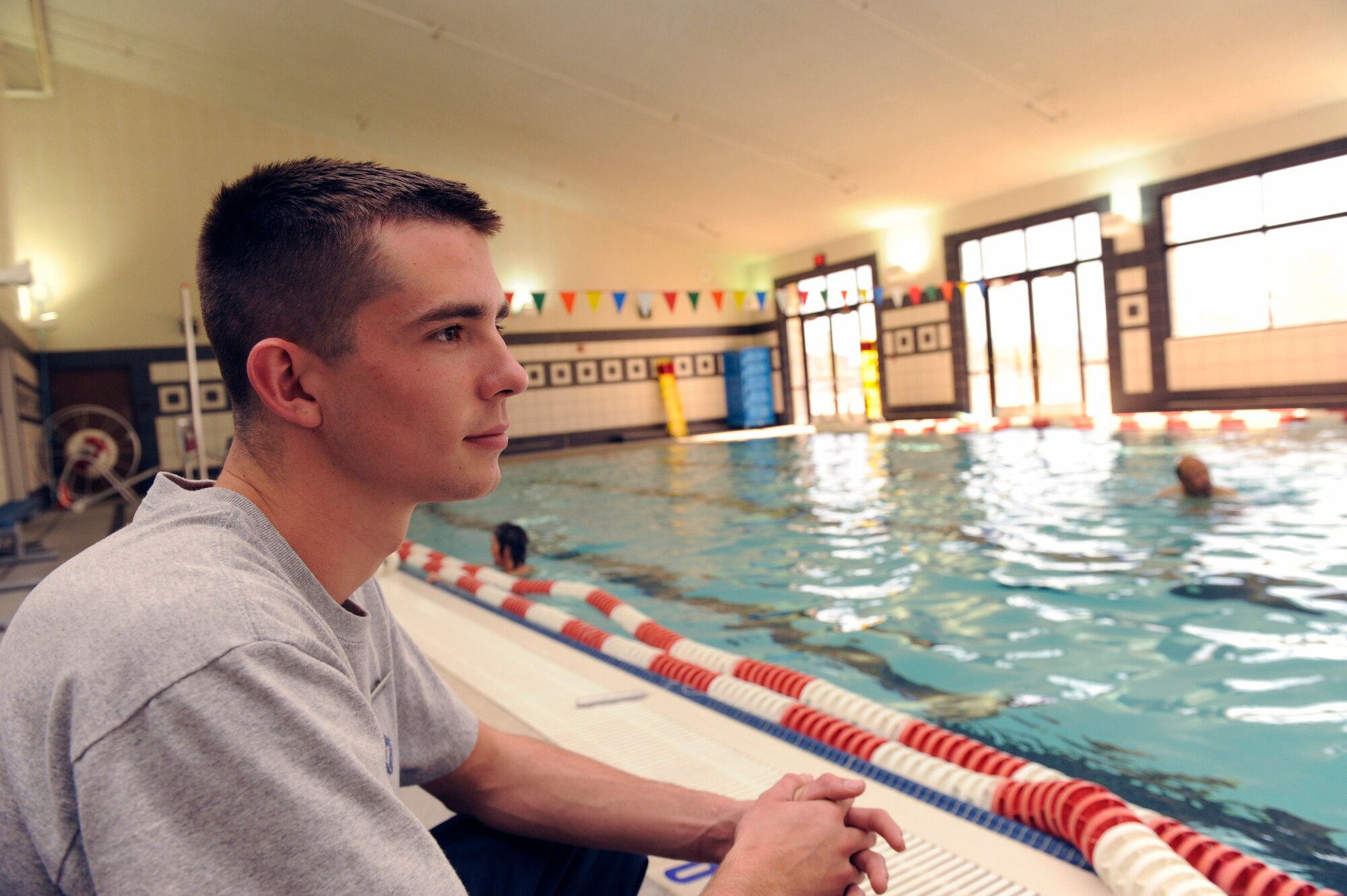 HOLLOMAN AIR FORCE BASE, N.M. -- Airman Terry Phelan, 49th Force Support Squadron, keeps a watchful eye on the swimmers by the pool at the Dominci Fitness Center May 5, 2010. Airman Phelan has many responsibilities being a lifeguard, such as providing first aid if necessary, protecting the pool environment and assisting with directions. To accomplish these things, a lifeguard must be physically fit, regularly exercise and feel comfortable in the water. (U.S. Air Force photo by Airman 1st Class Eileen Payne / Released)
