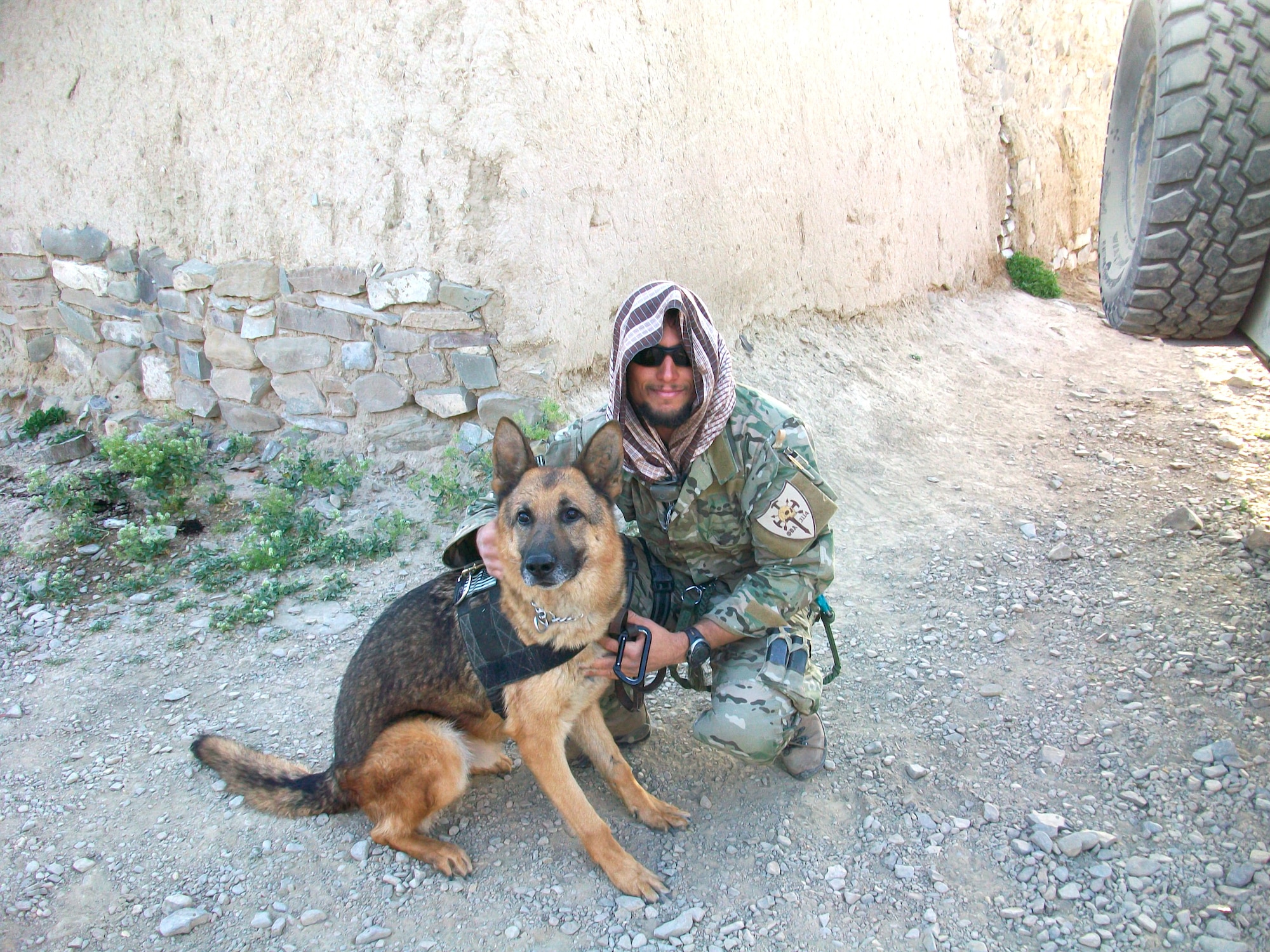 Staff Sgt. Marc Espisito, 21st Special Tactics Squadron, poses with a military working dog during his 2009 deployment to Afghanistan. Sergeant Espisito is competing in the 2010 Inaugural Warrior Games, slated May 10 to 14. (U.S. Air Force Photo/Courtesy)