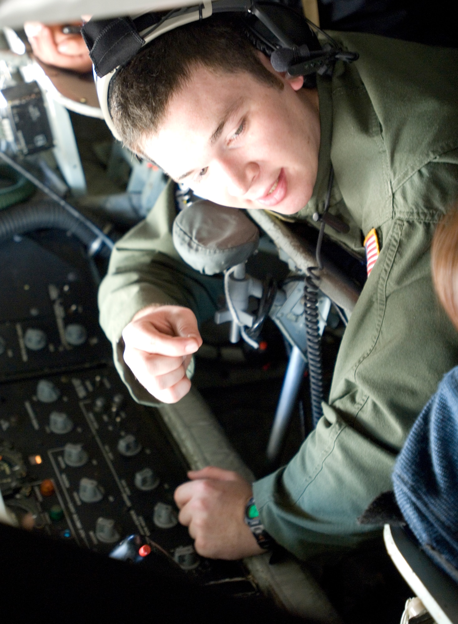 Airman 1st Class Christopher Harris, 344th Air Refueling Squadron boom operator, explains his job to 15 Army Junior Reserve Officer Training Corps cadets from Wichita North High during a mid-air refueling flight May 7, 2010. Airman Harris flies approximately three times a week to refuel a variety of aircraft. (U.S. Air Force photo/ Amn Armando A. Schwier-Morales)