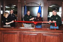 MINOT AIR FORCE BASE, N.D. -- Minot Air Force Base senior leadership take part in a ribbon cutting ceremony for the newly renovated clubhouse at the Rough Riders golf course here May 8. The new clubhouse will provide golfers a place to relax while spending some time on the links. (U.S. Air Force photo by Senior Airman Michael J. Veloz) 
